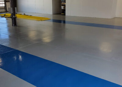 Commercial epoxy floor with blue stripe